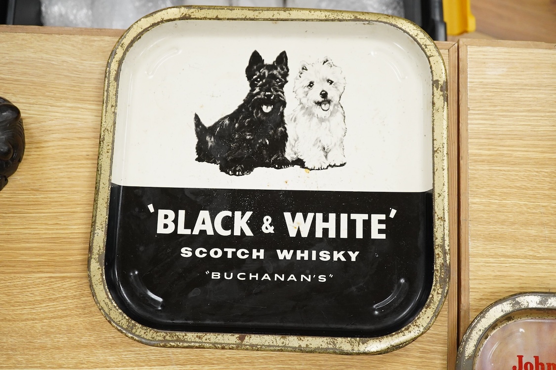 Five 1960s pub advertising trays for Scotch Whisky to include Johnnie Walker and Black & White, Buchanans, 35cm wide